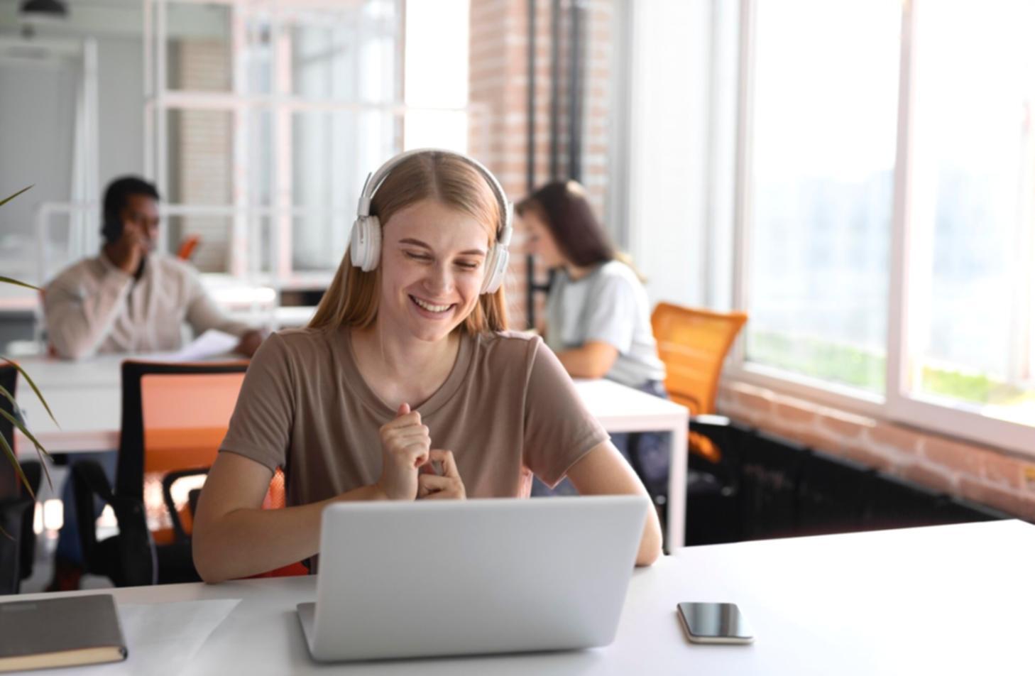 Modern collaborative workspace with natural lighting where finance professionals work together